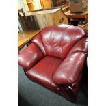 A Burgundy leather armchair