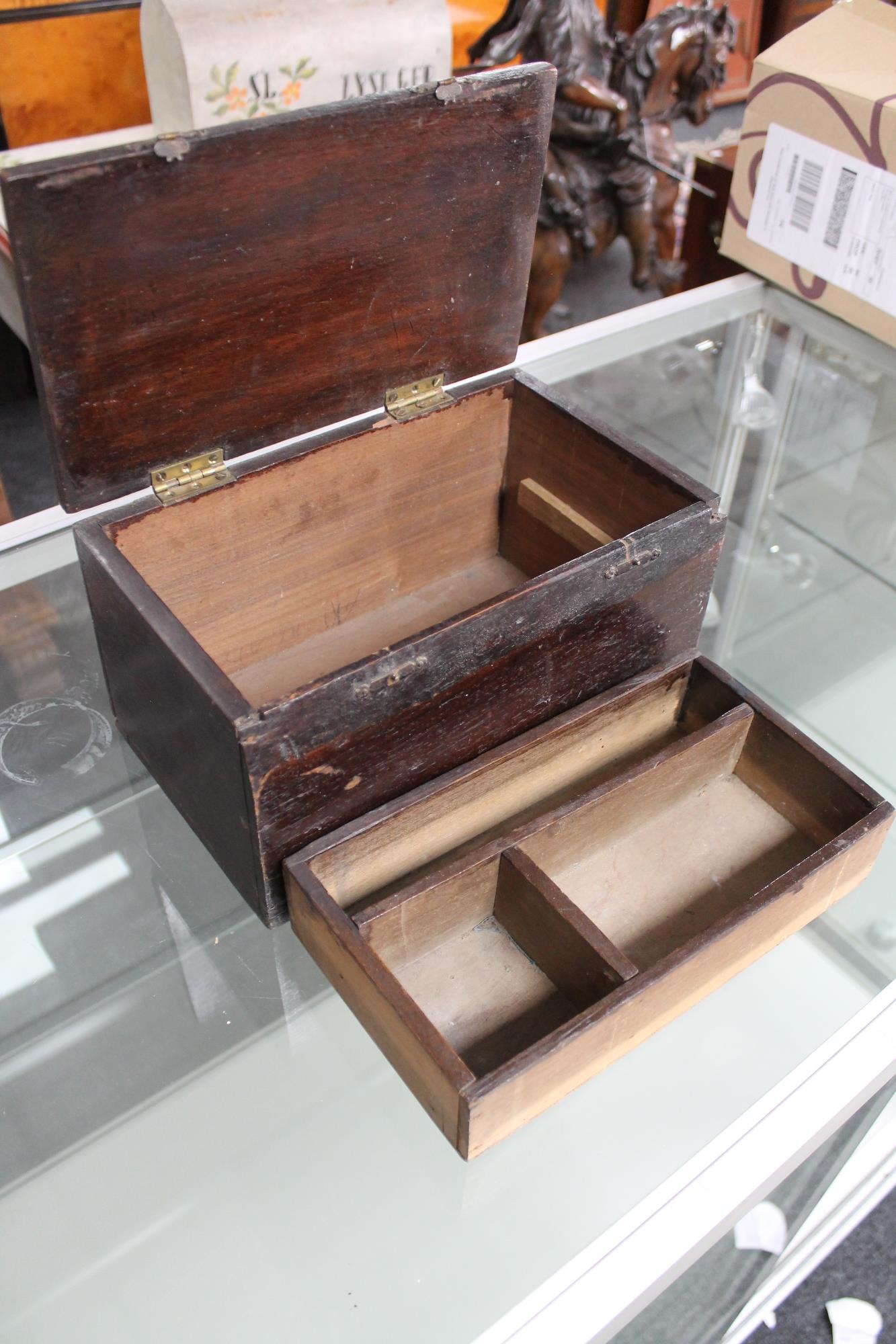 An antique box with lift out tray