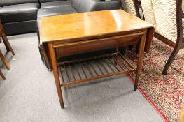 A mahogany flap sided table with undershelf