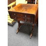 An early 19th century rosewood flap sided occasional table