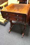 An early 19th century rosewood flap sided occasional table