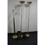 Three brass floor lamps together with a brass tick pot