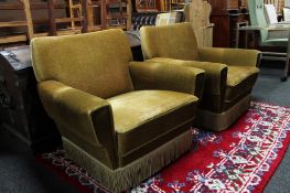 A pair of mid century armchairs