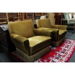 A pair of mid century armchairs