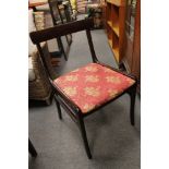 A contemporary mahogany effect dining table and four chairs