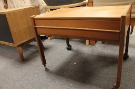 A teak single drawer sewing table