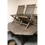 A wooden garden table and four chairs