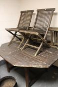 A wooden garden table and four chairs