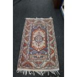 A Persian rug of geometric design,