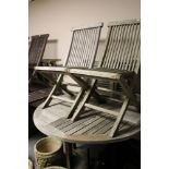 A wooden garden table and four chairs