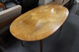 A mid century mahogany coffee table