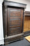 A nineteenth century stained pine side cabinet on paw feet