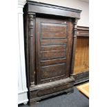 A nineteenth century stained pine side cabinet on paw feet