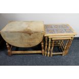 A nest of three blonde oak tiled top tables and a drop leaf coffee table