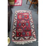 A Caucasian design rug,