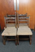 A set of four antique carved oak dining chairs