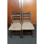 A set of four antique carved oak dining chairs