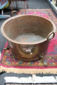 An early 20th century large copper log bin