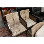 A pair of bergere armchairs in hide covering