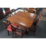 A good quality early 19th century mahogany extending dining room table with two leaves,