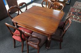 A good quality early 19th century mahogany extending dining room table with two leaves,