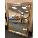 A golden framed mirror