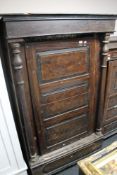 A nineteenth century stained pine cabinet with pillar supports