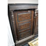 A nineteenth century stained pine cabinet with pillar supports