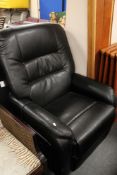 A black leather electric reclining armchair with continental plug