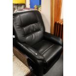 A black leather electric reclining armchair with continental plug