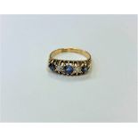 An antique 18ct gold sapphire and diamond ring