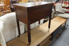 An early twentieth century beechwood sewing trolley