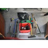 A quantity of garden tools, clothes rack,