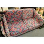 A mid century purple floral striped two seater settee