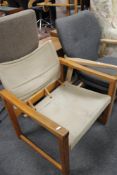 A mid century pine sling seated chair