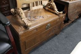 A carved camphor wood chest CONDITION REPORT: 92cm by 46cm by 49cm.