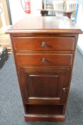 An Edwardian mahogany bedside cabinet