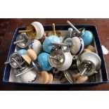 A box of porcelain and wooden drawer knobs