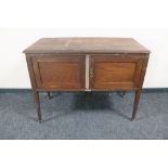 An Edwardian oak wash stand