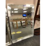An all glass mitre corner mirror