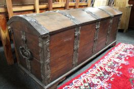 A nineteenth century oak metal domed shipping trunk