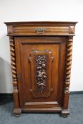 A nineteenth century carved oak wall cabinet