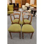 A set of four early 20th century beech dining chairs