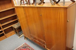 A mid century teak sideboard fitted with two drawers