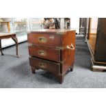 A reproduction mahogany three drawer chest with metal mounts