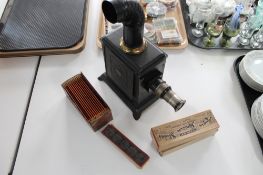 An early 20th century Magic Lantern together with slides