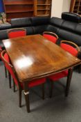 A mid century extending beech dining table and seven chairs