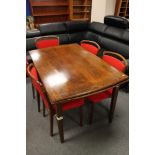 A mid century extending beech dining table and seven chairs