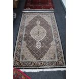 A Tabriz rug of millefiori design,