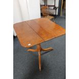 A 19th century stained pine tilt top occasional table